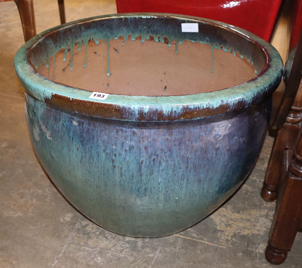 A blue glazed pottery garden planter, W.59cm, H.47cm